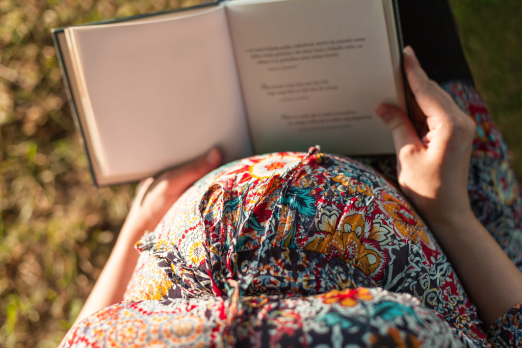 Pregnant woman reading Healthy Mama Brand
